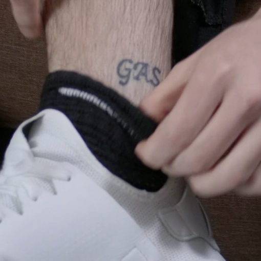 "gas" tattooed on an ankle