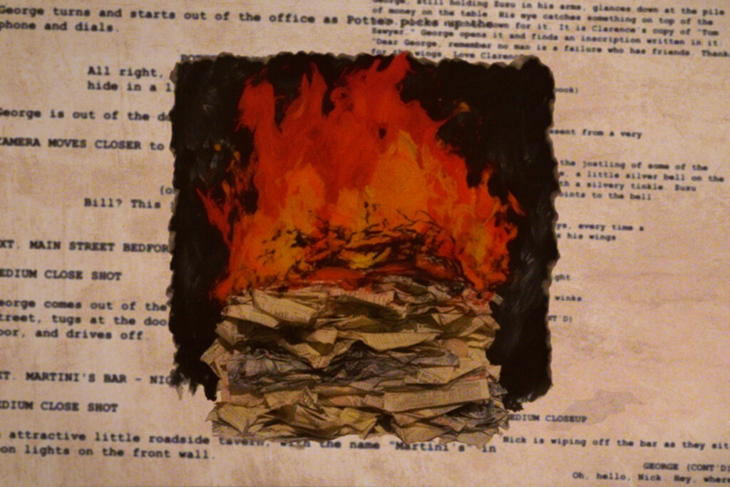 A stack of screenplays on fire