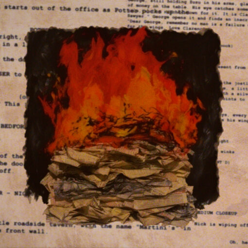 A stack of screenplays on fire